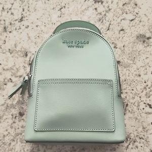 New mint green Kate spade mini backpack and matching wallet